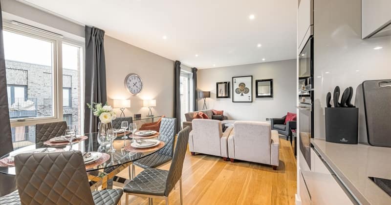 Nineteen On Sphinx, Battersea: Living and dining area beside full-height windows