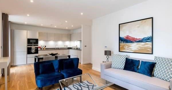 Ten On Danvers, Battersea: Open living and dining room beside white kitchen