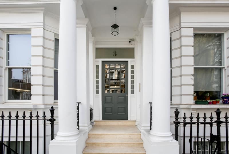 Cromwell Serviced Apartments, Earl's Court: White terrace entrance framed by classical columns