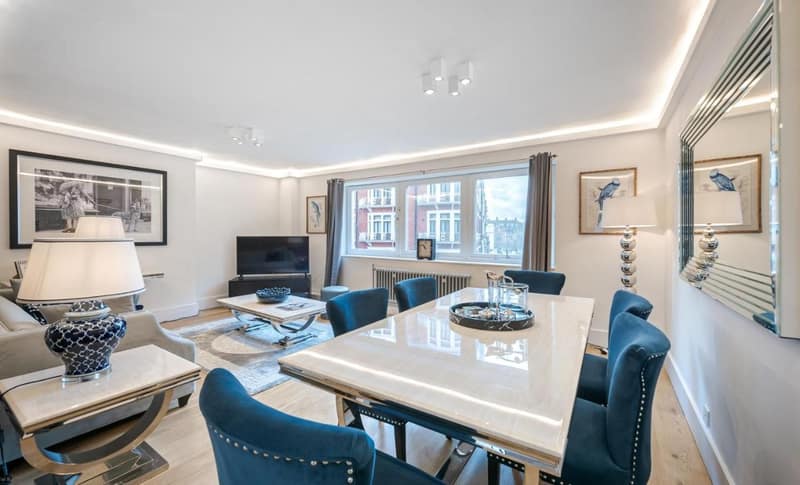 No. 8 Hans Crescent, Knightsbridge: Living room with sofa and glass dining table