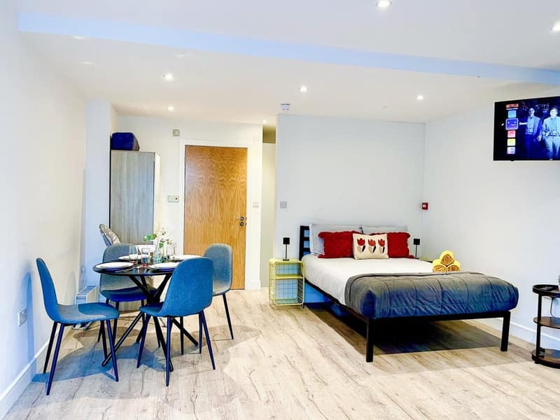 Liverpool Road One Bedroom Apartment, London: Living room with sofa and open kitchen