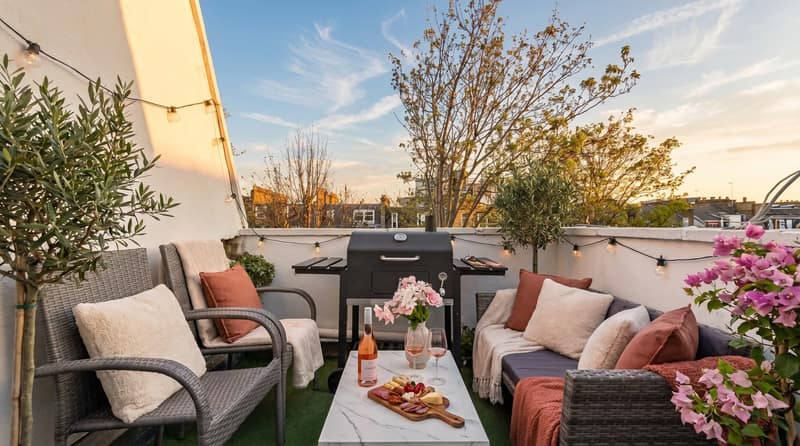 Marloes Road Two Bedroom Apartment, Kensington: Terrace with outdoor sofa and planted pots