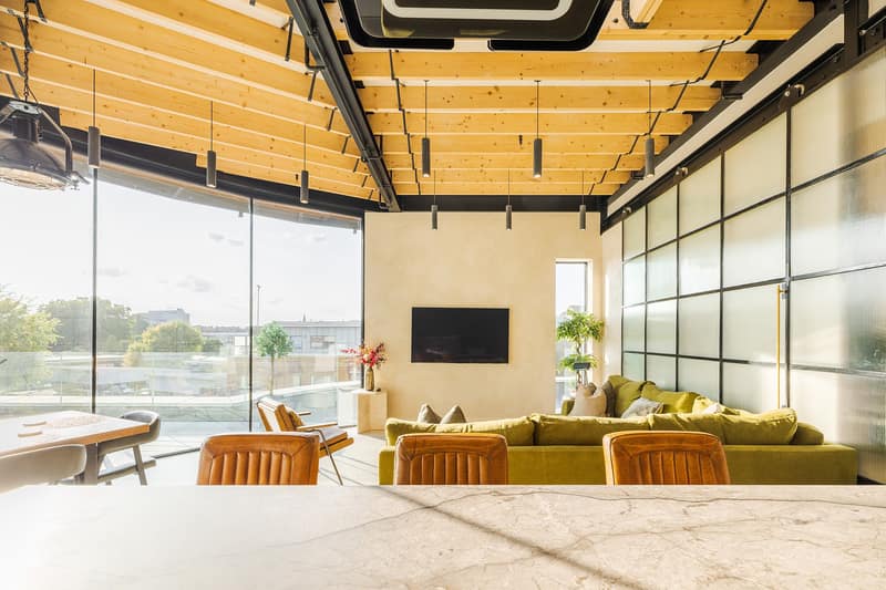 Noxley Fulham Three Bedroom Penthouse, Fulham: Open-plan room with island and yellow seating