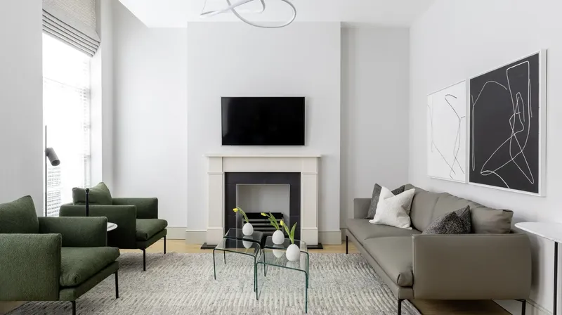 AKA Marylebone, Marylebone: AKA Marylebone: Suite living room with pale sofa and fireplace, photo 1